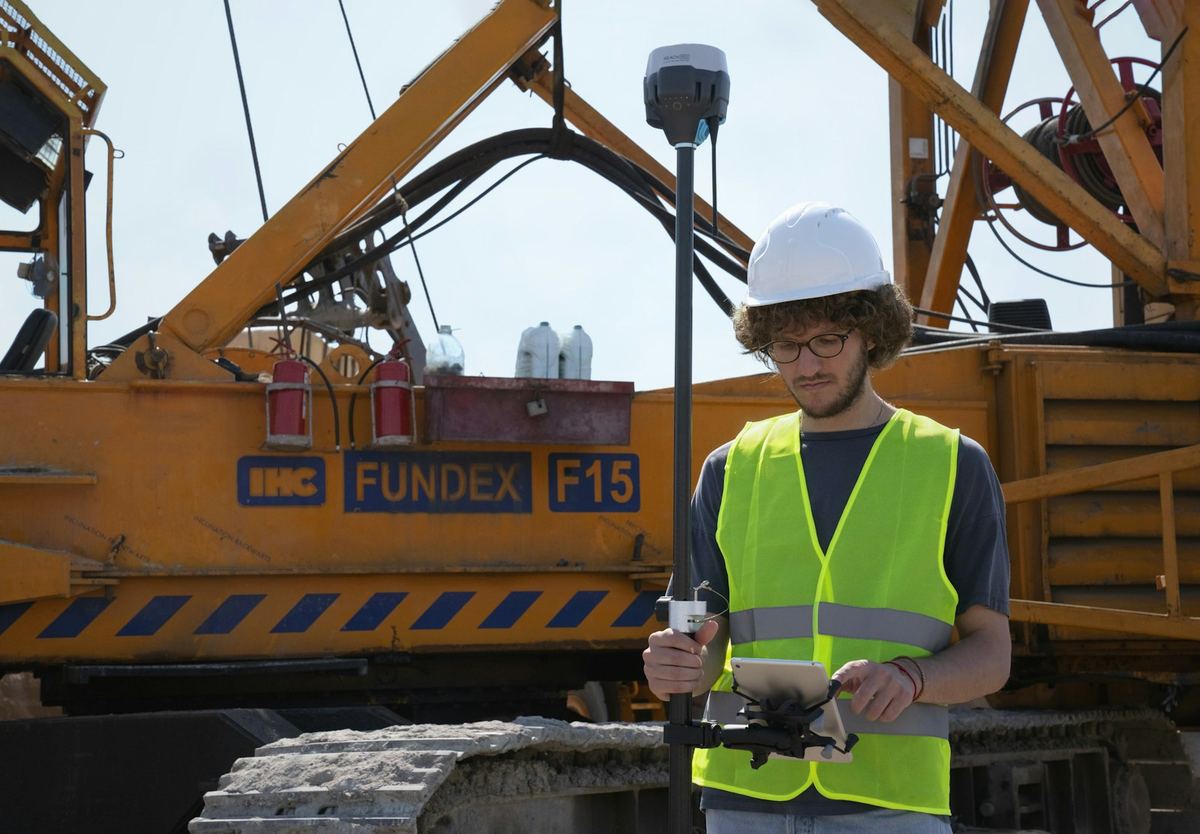 Site engineer with survey equipment